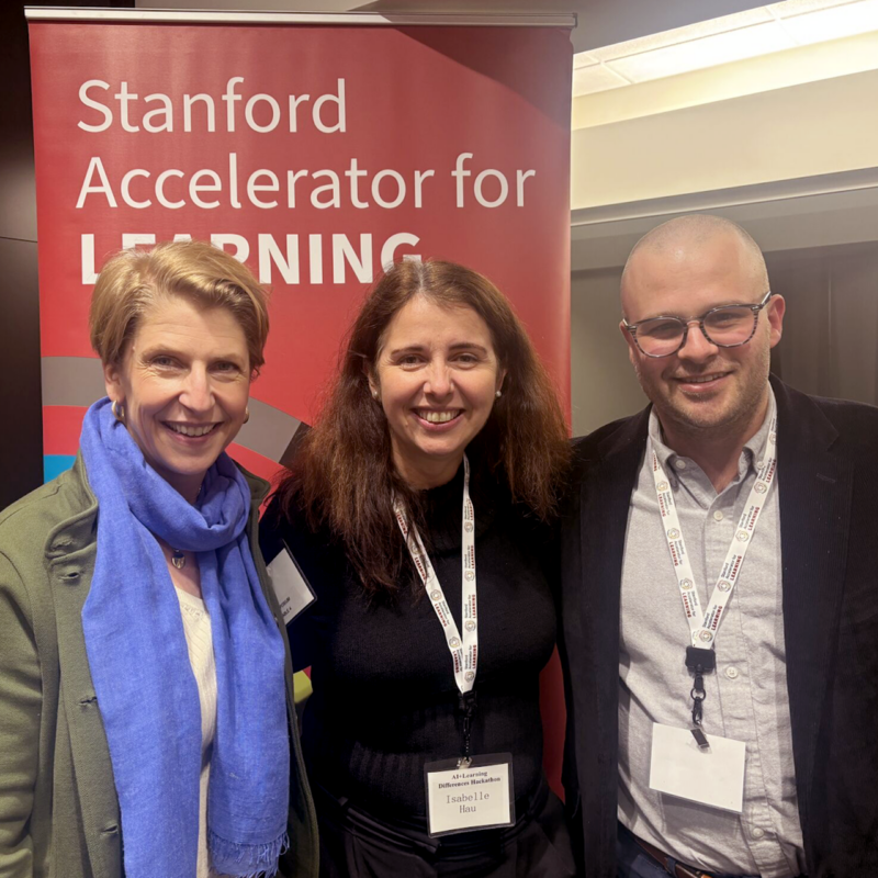 Lindsay Jones, CEO of CAST, standing next to Isabelle Hau, Executive Director of Stanford University's Accelerator for Learning, and Bobby Moore, Chief of Staff at CAST.